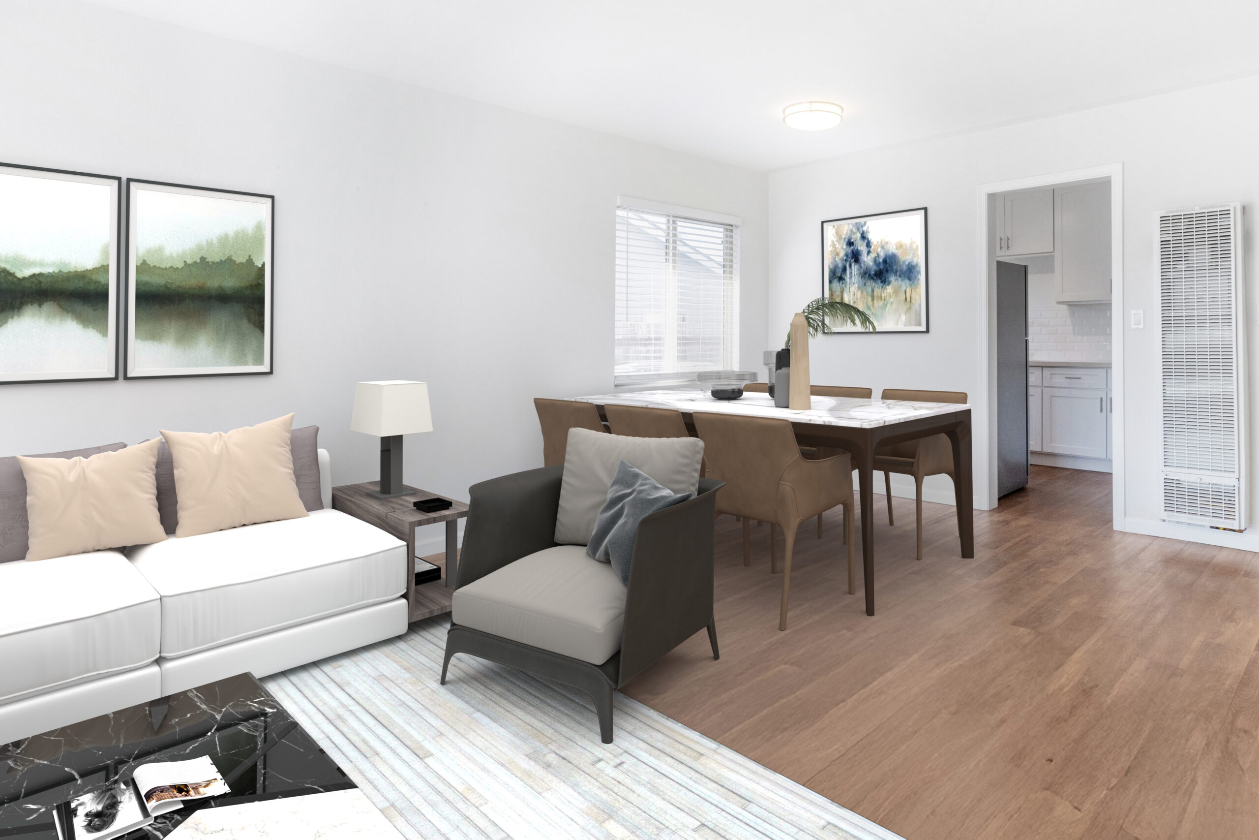 Gallery Bright coastal living room with white sofa, dining area, and natural light.