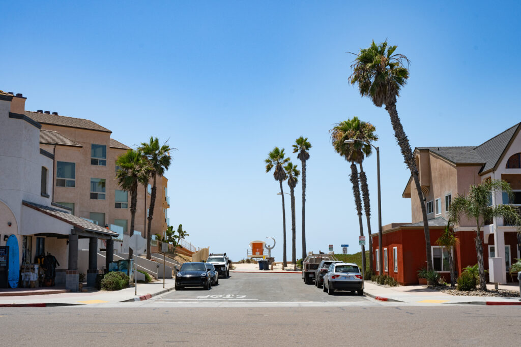 Gallery Palm-lined street leading toward the beach in Imperial Beach, California.