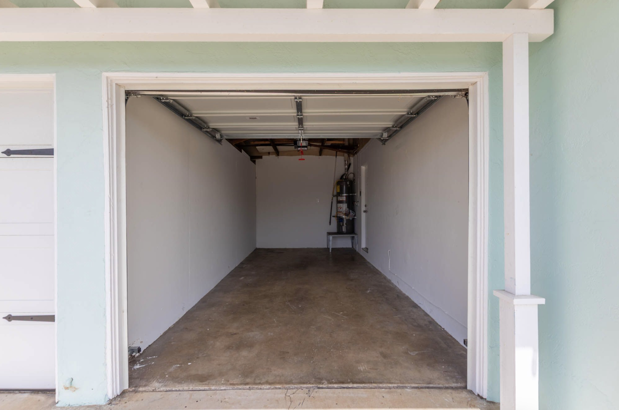 Gallery Single-car garage entrance at an Imperial Beach duplex rental residence.