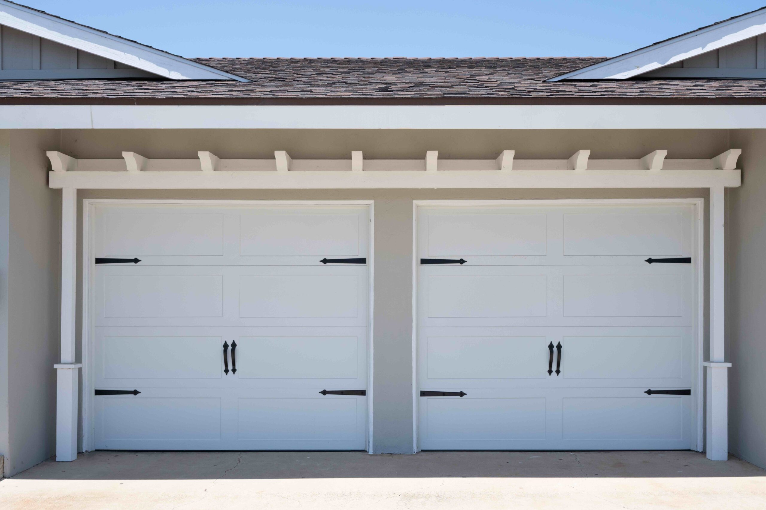 Gallery Exterior view of attached garage doors at The Dahlia Coastal Bungalows in Imperial Beach.